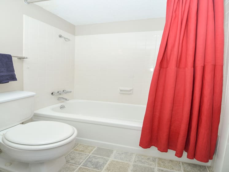 Bathroom with Tile Style Flooring and Large Shower with Tub