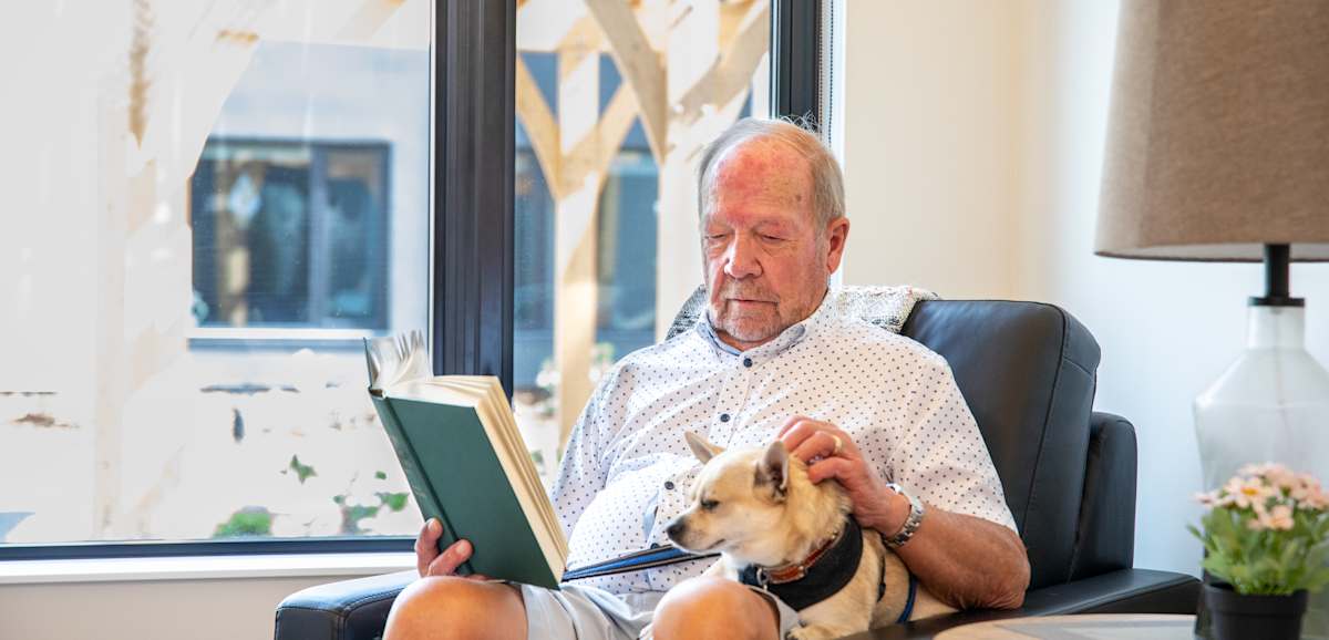 Resident relaxing with a beagle