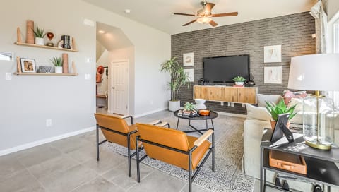 Homes for Rent in Reno-Aspen Vista at Anchor Pointe Apartments Living Room With Brick Wall And Modern Decor And Square Tile Flooring