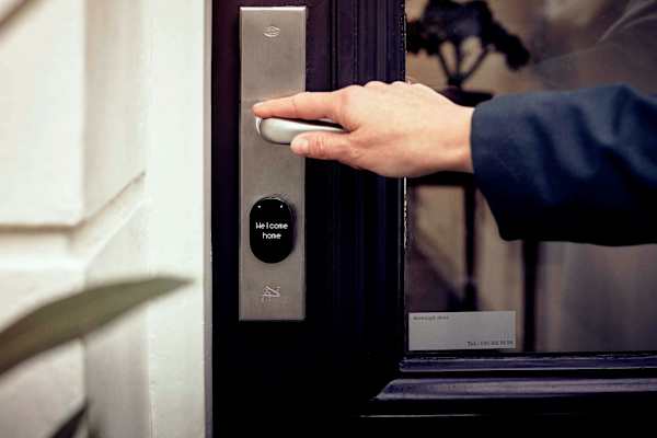A person is opening a door at Twenty Fair Apartments, New Haven