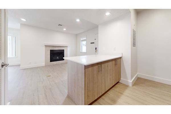 Kitchen with wooden cabinets at Avia Lofts at Maple Road, Amherst, NY, 14221