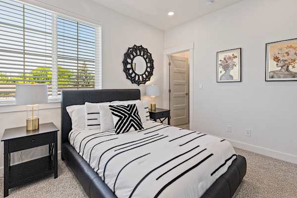Modern bed with window at AVIA Lofts on Victors Way, Idaho