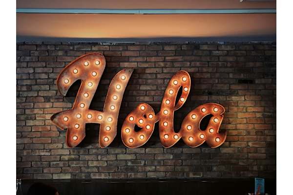 A neon sign with the word at AVIA Lofts on Victors Way, Idaho, 83709