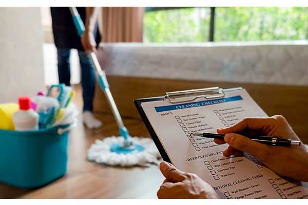 A person is checking off items on a cleaning checklist. at 605 Place Student Housing & Co-Living, St George, UT