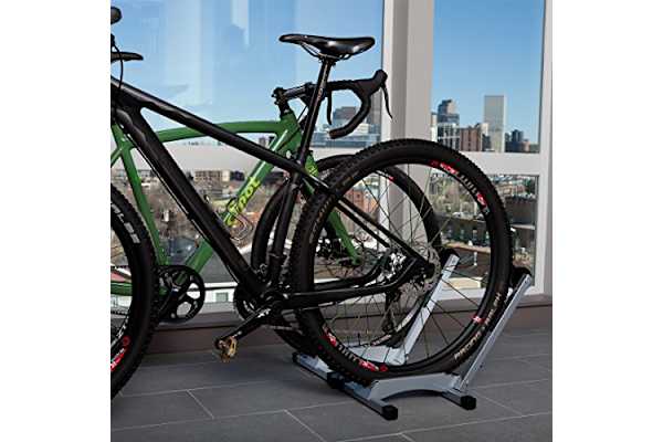 a bike on a bike stand in front of a window
