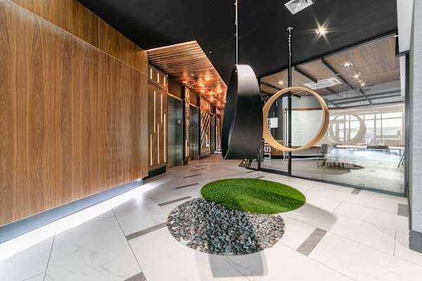 A modern interior with a green circle on the floor.