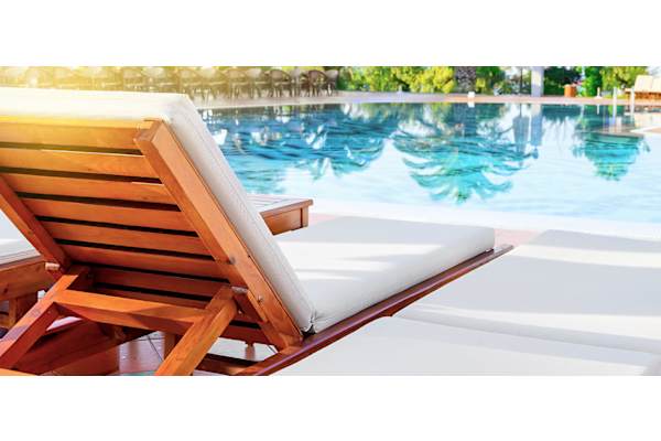 Deck chair along side the pool to enjoy the sunbath