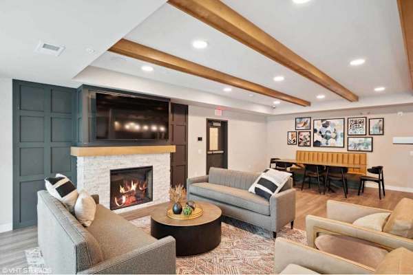 A living room with a fireplace and a couch.