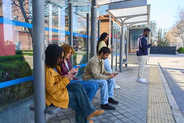 People waiting at a bus stop.