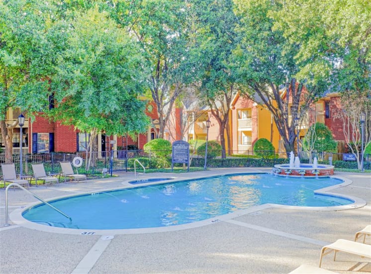 Resort style pool of Saddle Brook Apartments in North Dallas, TX, For Rent. Now Leasing 1, 2 and 3 bedroom apartments.