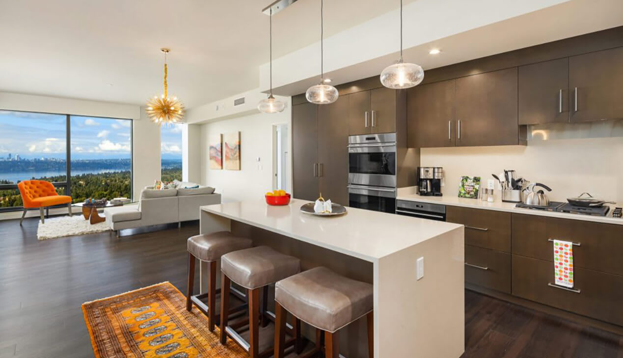 Modern Kitchen With Stainless Steel Appliances And Double Door Refrigerators