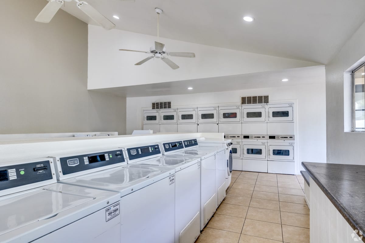 Shared laundry room with washers and dryers at Sagewood Apartments