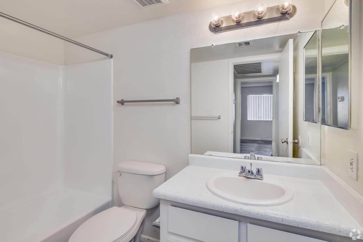 Bathroom with vanity, toilet and tub at Sagewood Apartments