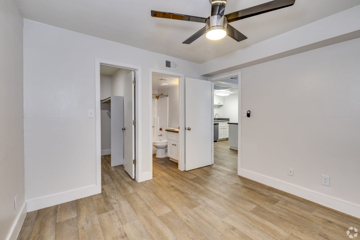 Unfurnished room with closet and bathroom access at Sagewood Apartments