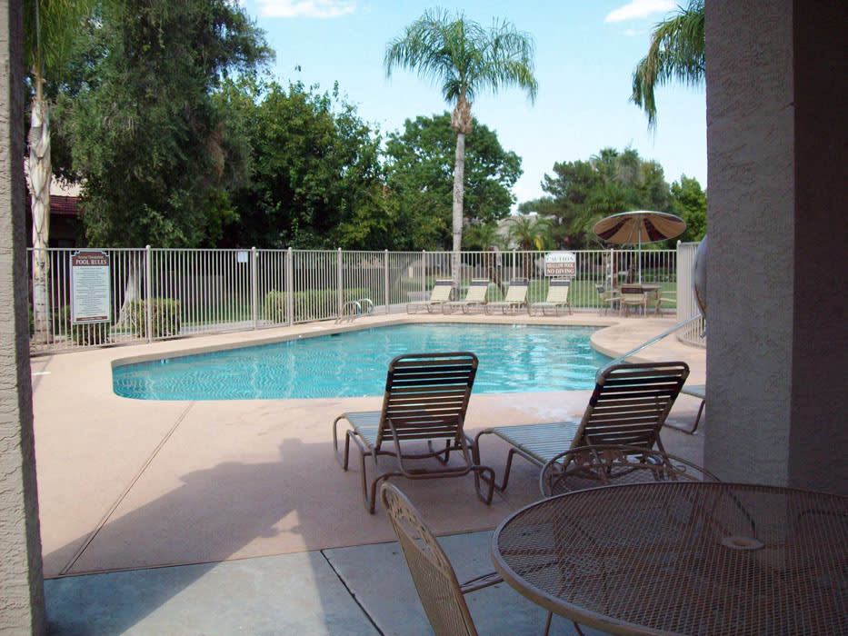 Swimming pool and poolside seating at Acoma Thunderbird Townhomes