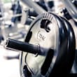 A gym with treadmills, exercise bikes, and weight machines.