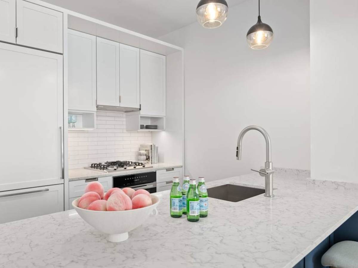 Open-plan kitchen with Miele appliances