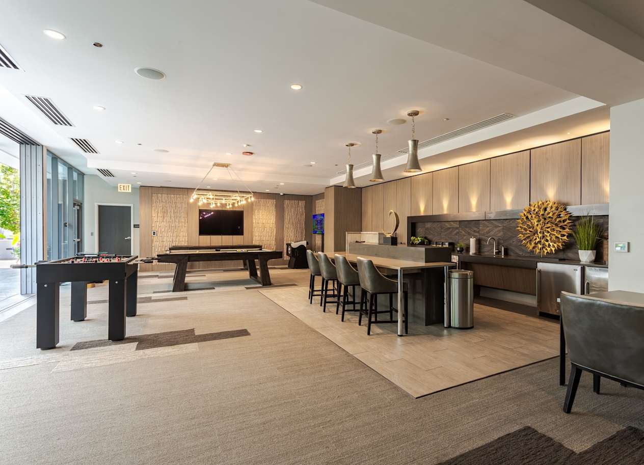 a clubhouse with a billiards table and a pool table at The Grand Central Apartments in Chicago, 60607