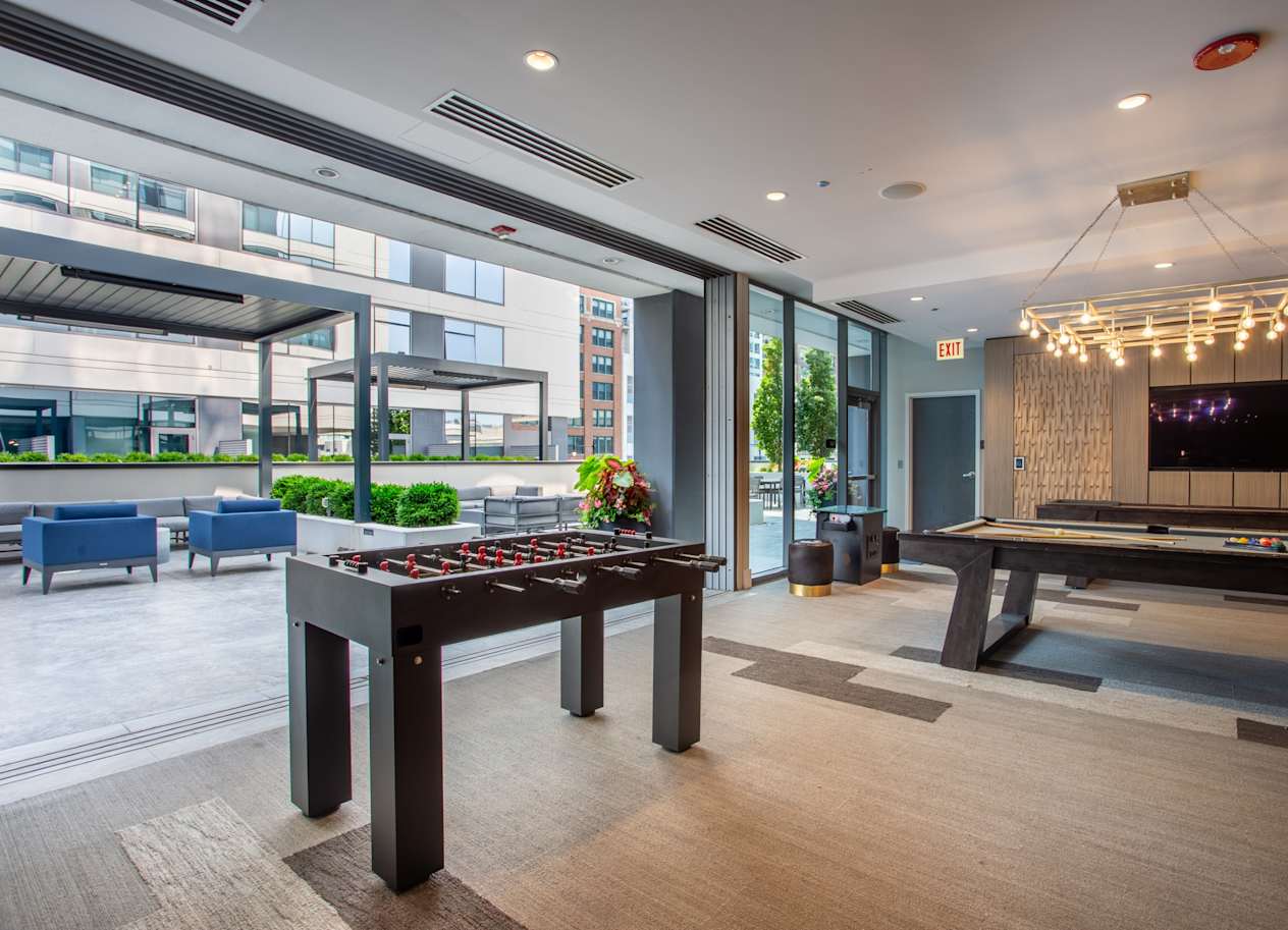 Community Lounge with Foosball and Billiards Table at The Grand Central Apartments in Chicago, IL 60607