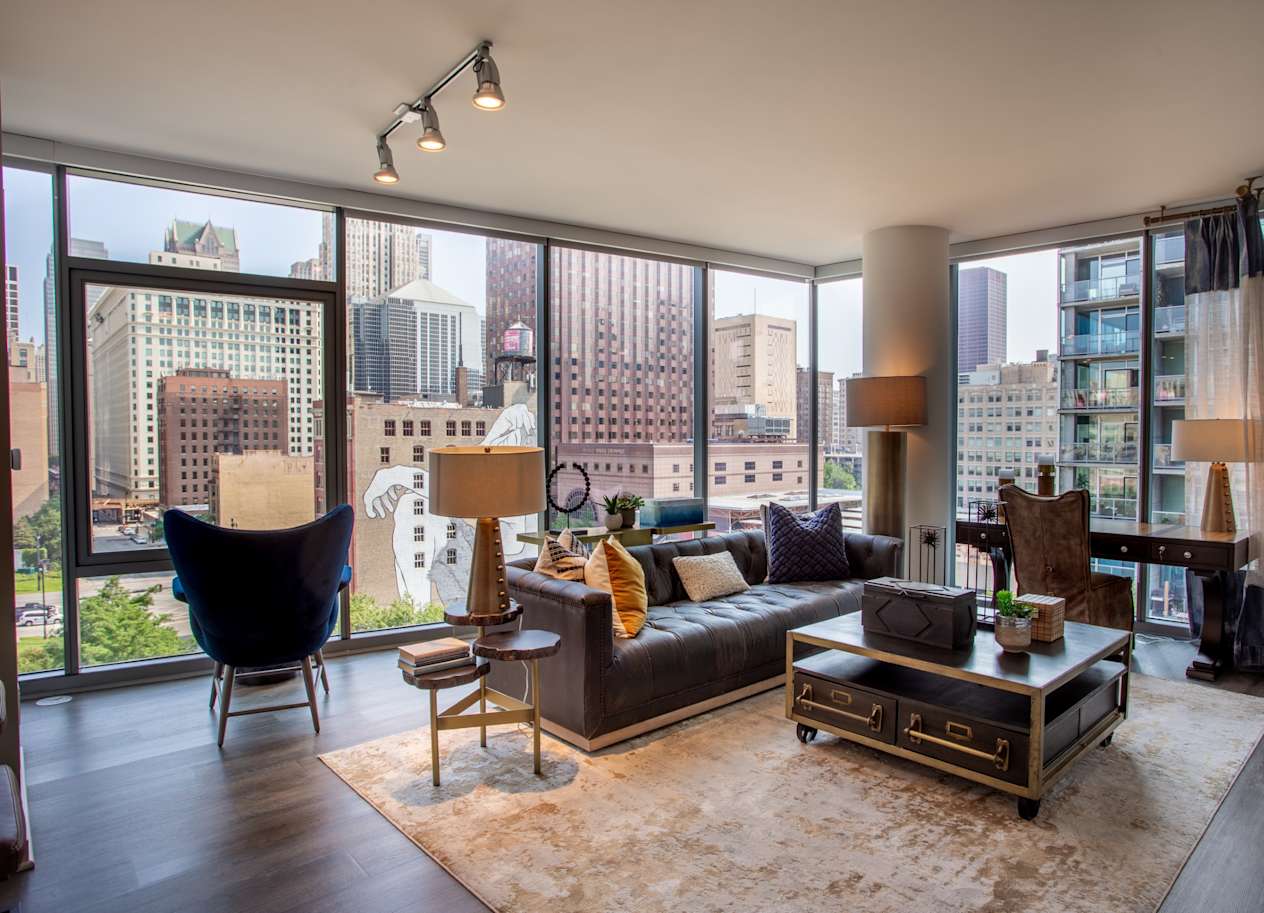 Living Room with Floor-to-Ceiling Windows at The Grand Central Apartments in Chicago, IL 60607