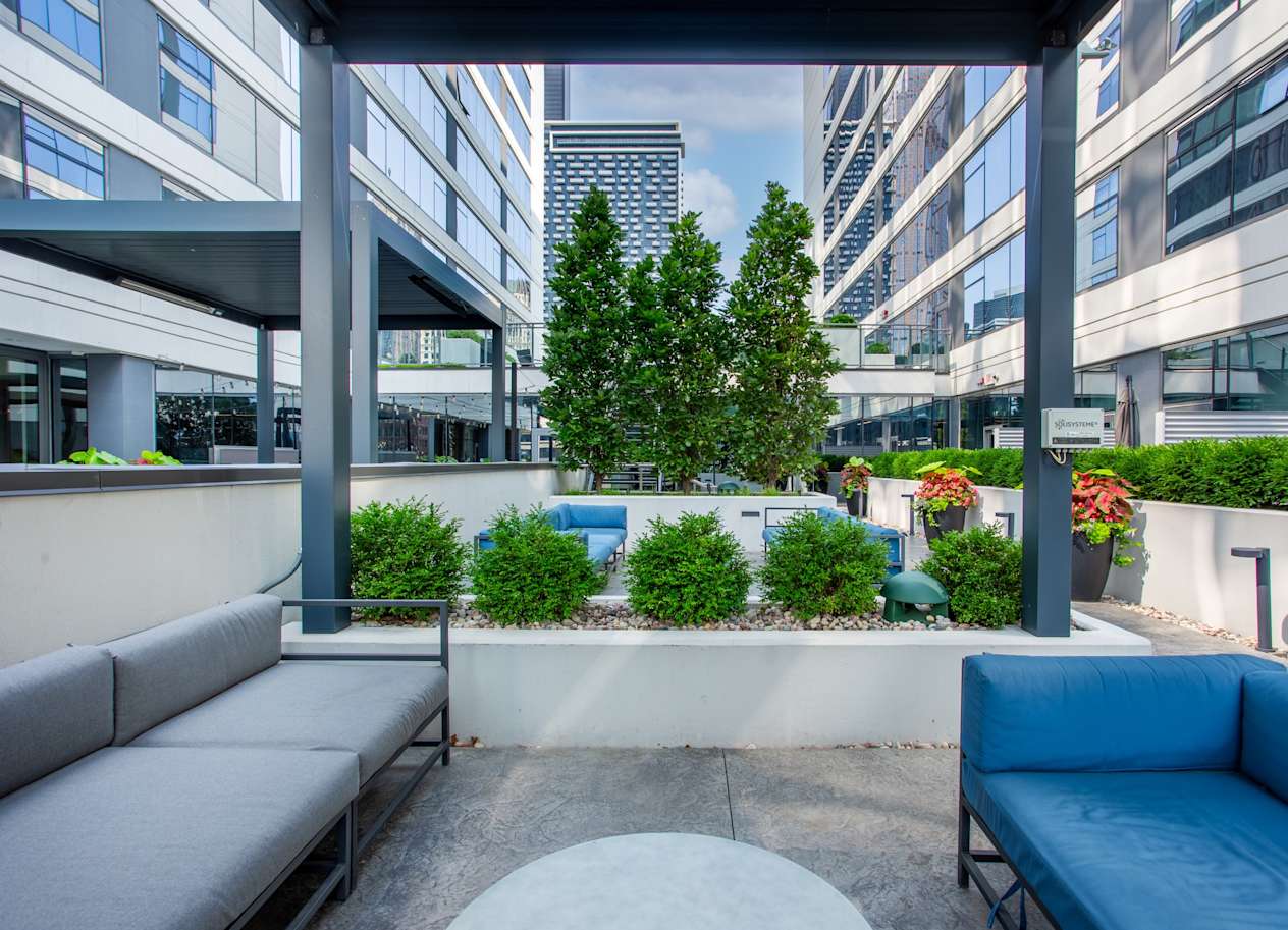Outdoor Patio with Seating and Landscaping at The Grand Central Apartments in Chicago, IL 60607