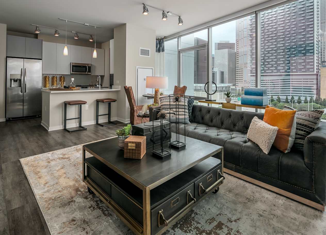 a living room with a couch and a coffee table at The Grand Central, Chicago