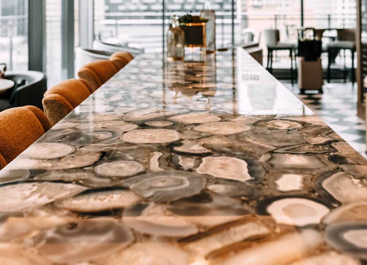 a long table with a view of the city at The Grand Central, Chicago