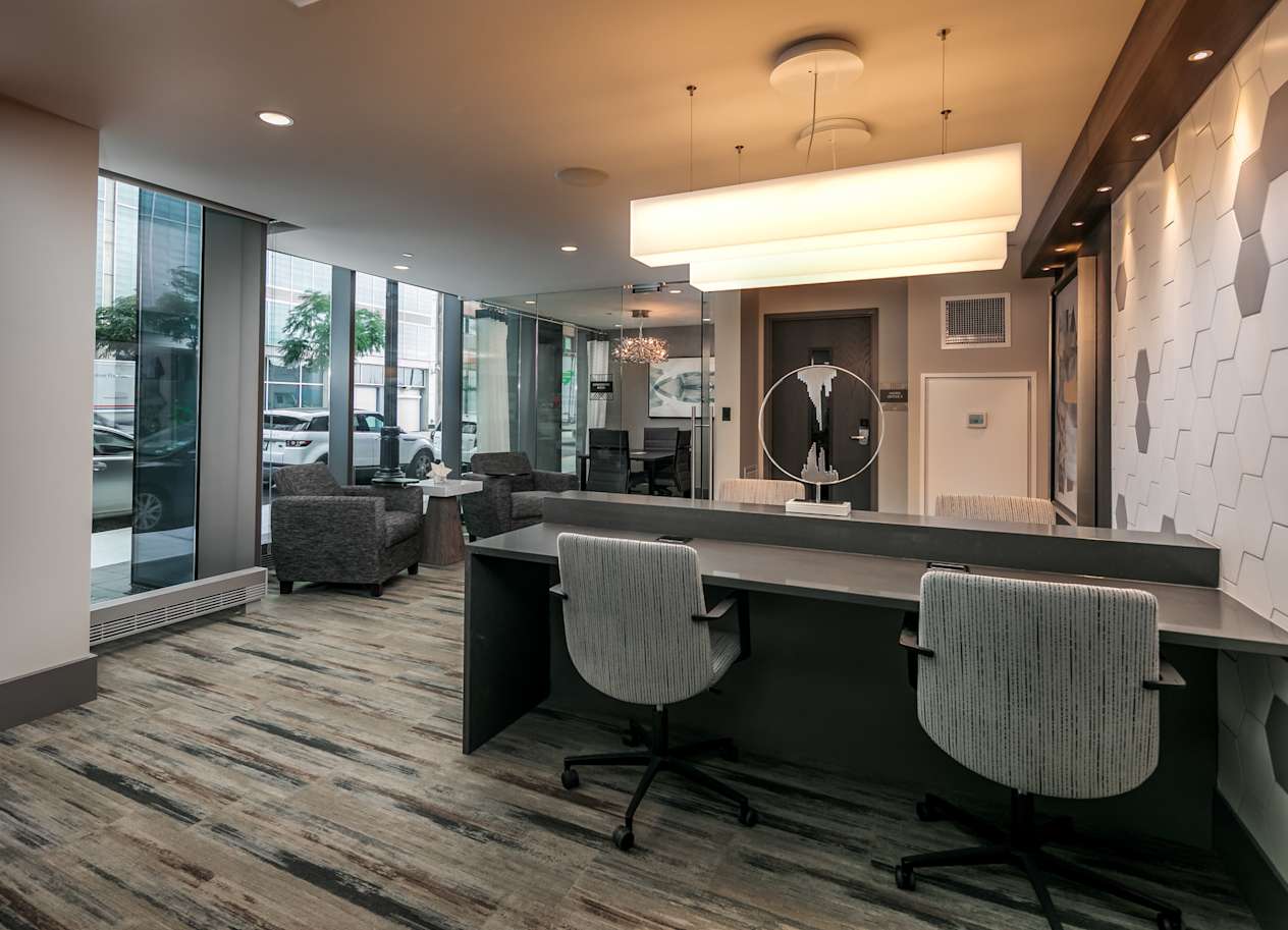a conference room with chairs and a table and a large window at The Grand Central, Chicago, 60607