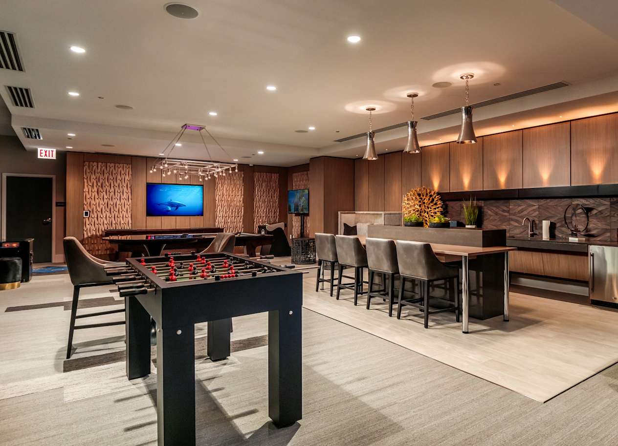 a game room with a pool table and a tv at The Grand Central, Illinois, 60607