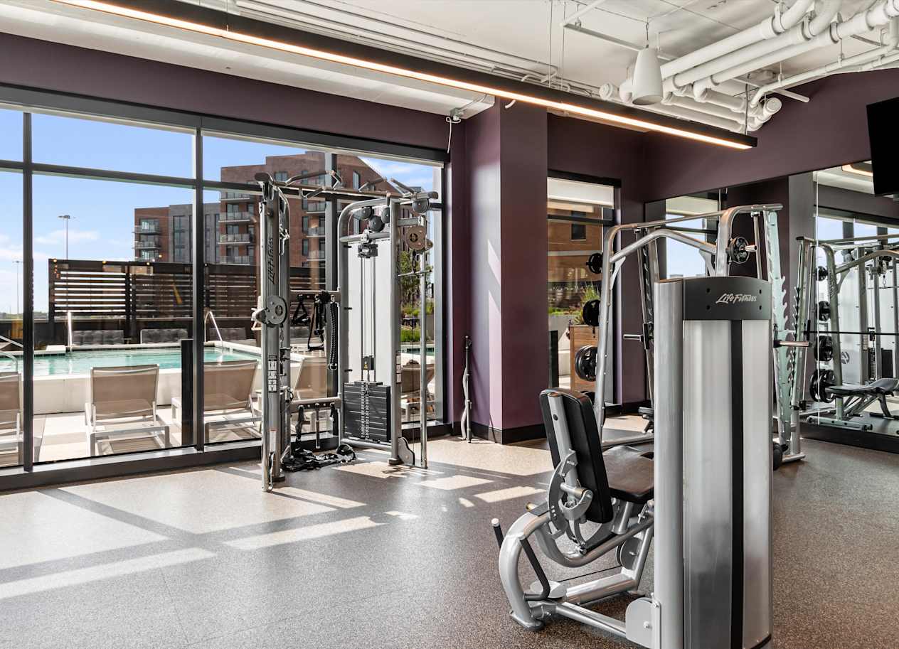 A gym with a view of the city.