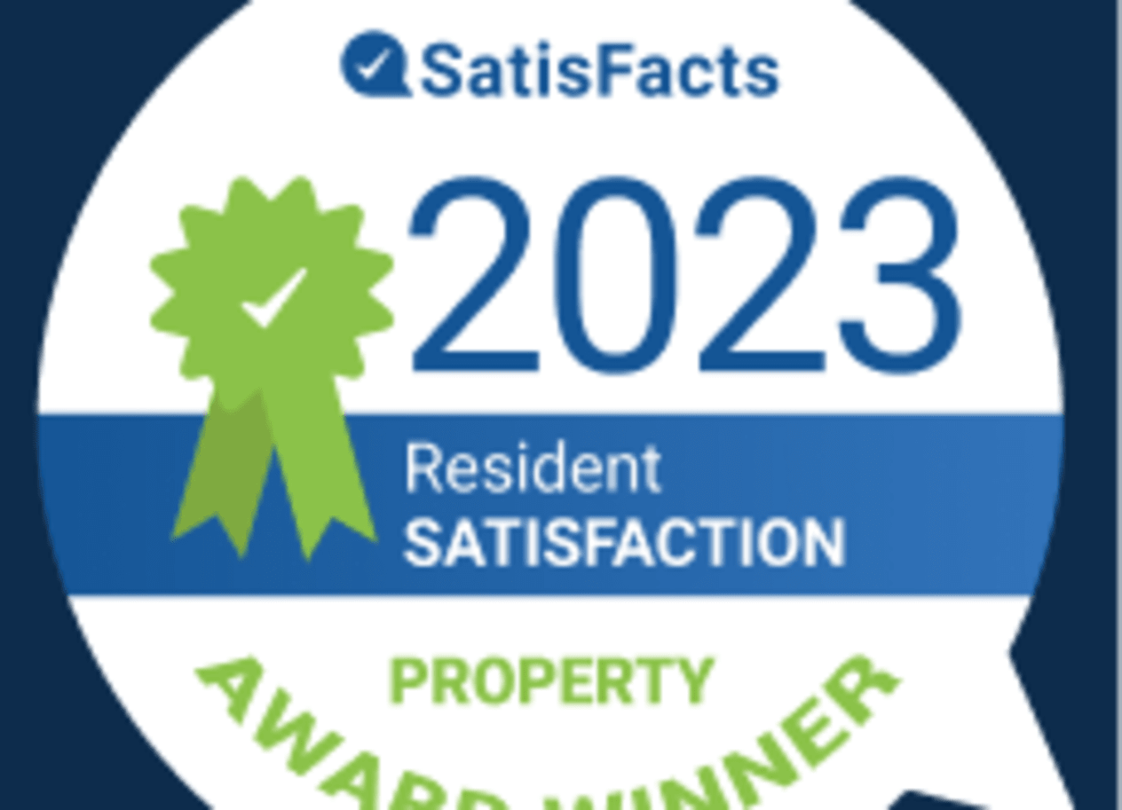 A badge indicating a property award winner for resident satisfaction in 2023.