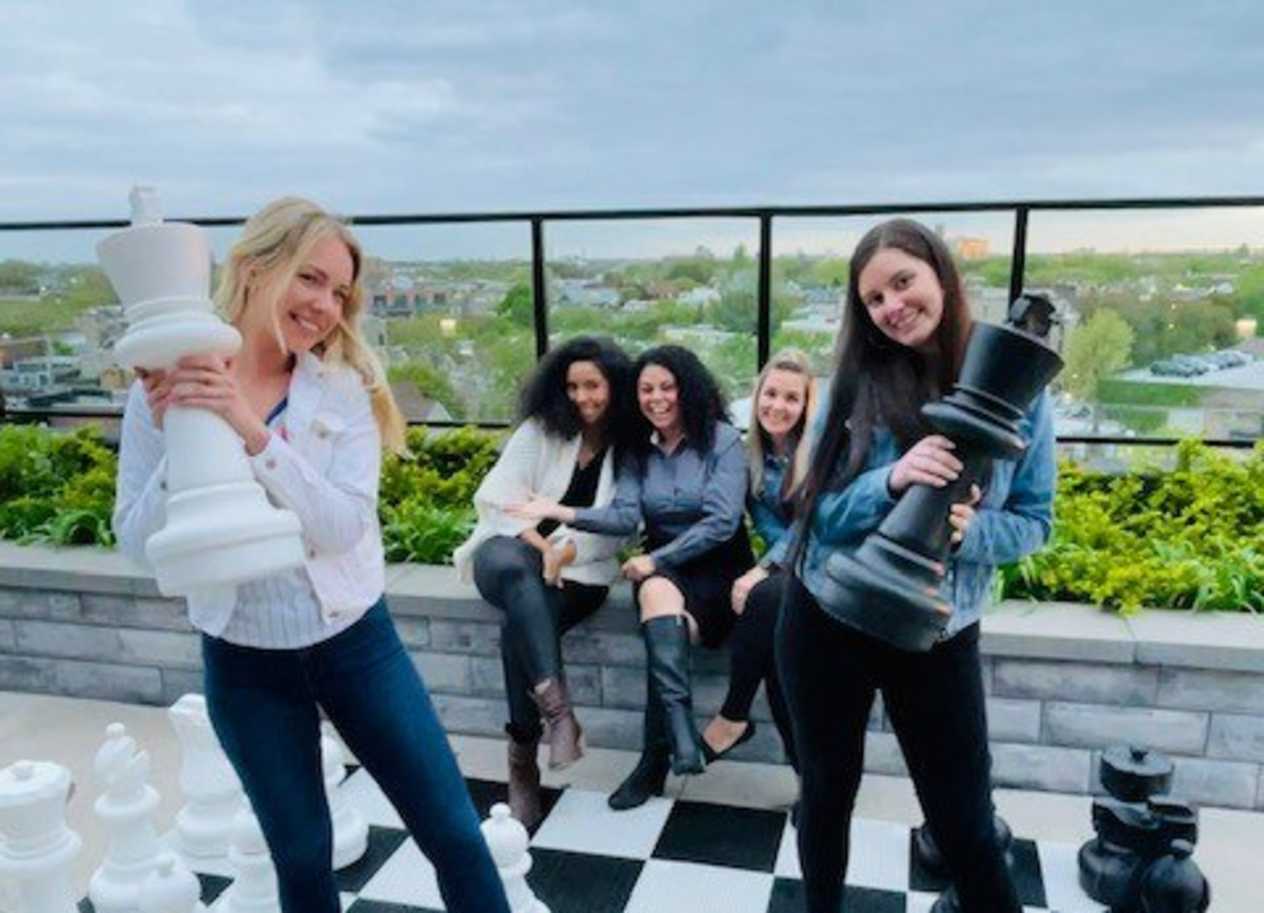 Friends Playing Chess at Residences at Addison Clark Apartments, Chicago