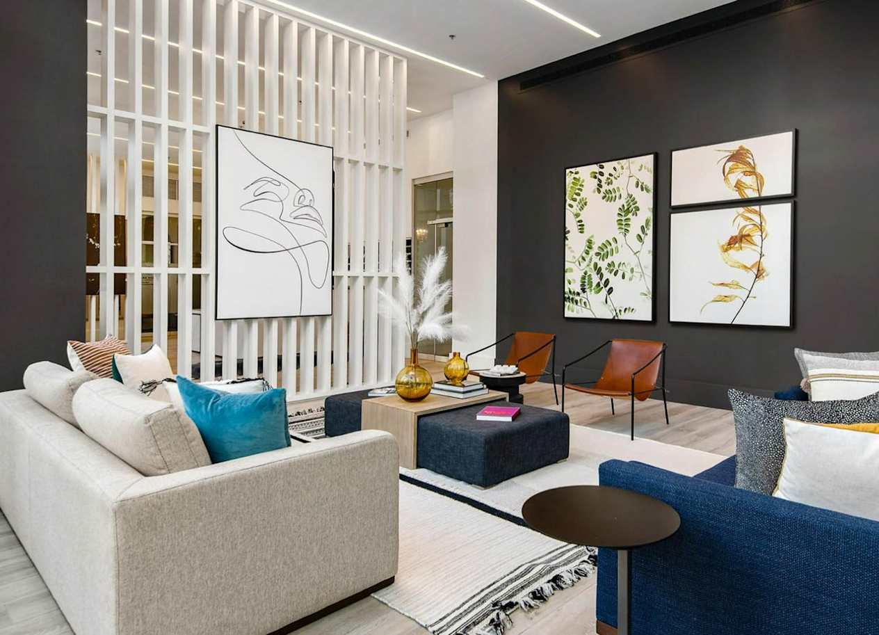 a living room filled with furniture and a large window