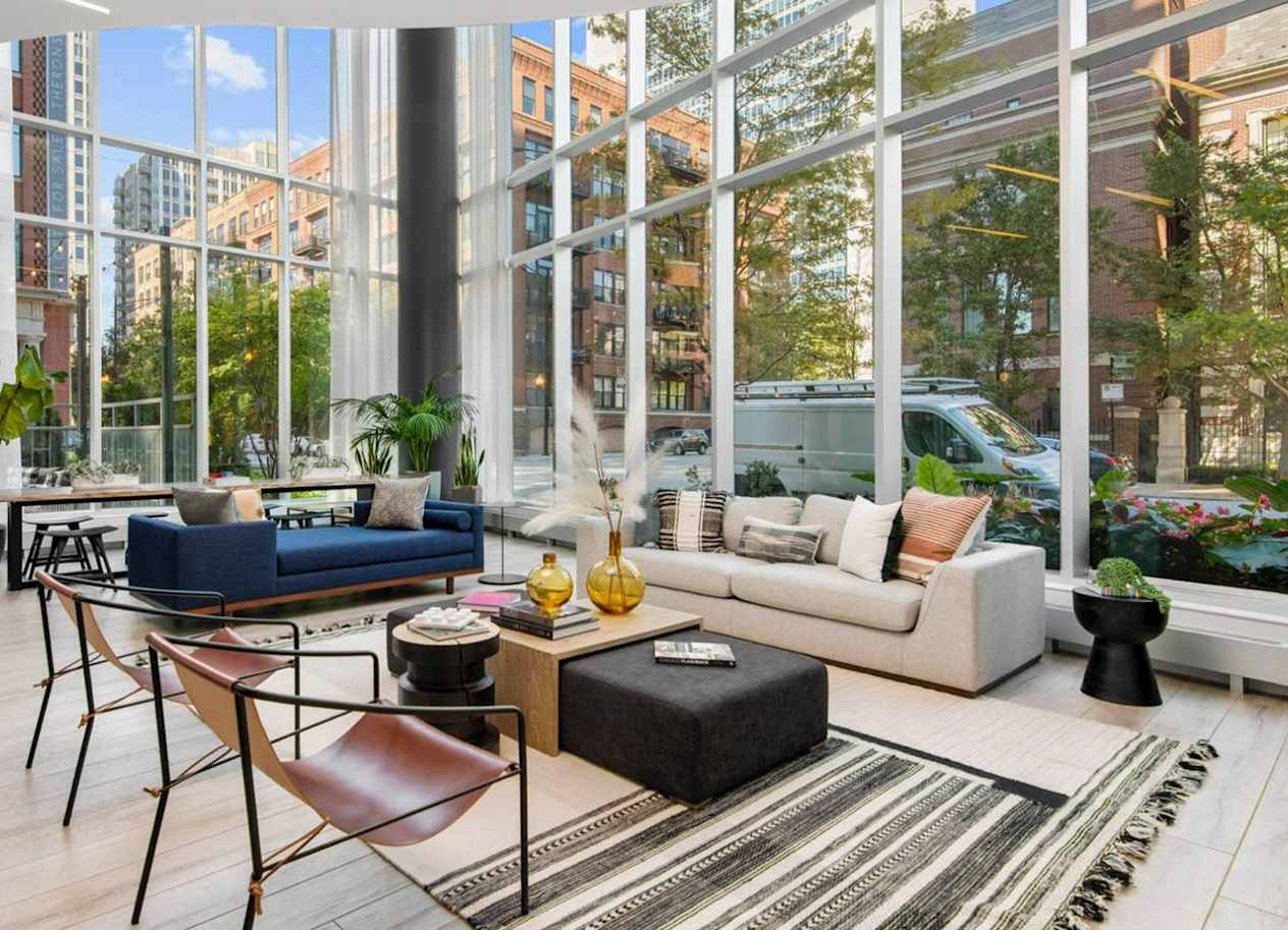 a living room with a large window and a view of a city