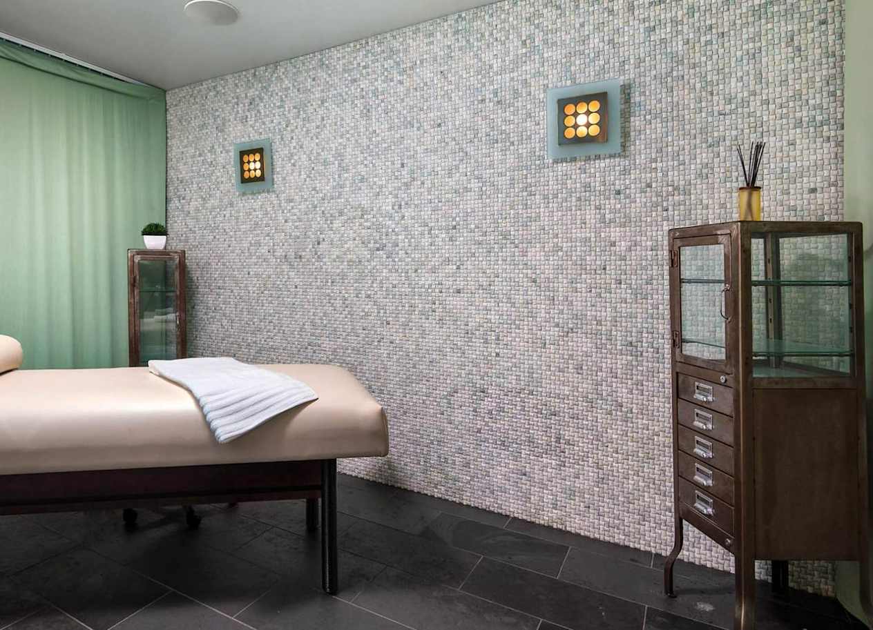 a room with a bed and a dresser