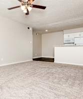 A room with a ceiling fan and carpeted floor. at Lovato, Garland, 75040
