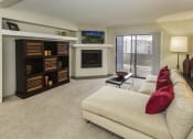 Thumbnail 13 of 25 - Television And Fireplace In Living Room at The Parc at Briargate, Colorado Springs, 80920