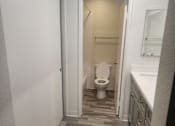 Thumbnail 29 of 82 - A bathroom with a toilet and a sink.
