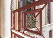 Thumbnail 13 of 74 - A red railing with a star decoration on it.