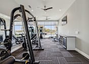 Thumbnail 9 of 39 - fitness center with exercise equipment at LynnCora, Grand Prairie, TX
