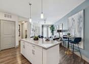 Thumbnail 20 of 39 - the preserve at ballantyne commons apartment living room and kitchen at LynnCora, Grand Prairie, Texas