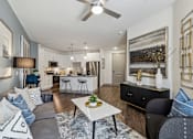 Thumbnail 23 of 39 - a living room with a couch and a table at LynnCora, Grand Prairie, 75052