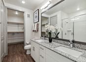 Thumbnail 35 of 39 - Model apartment with dual sinks in bathroom vanity at LynnCora, Grand Prairie, TX