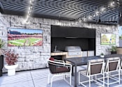 Thumbnail 11 of 14 - Modern outdoor dining area at Amara Luxury Apartments, Sacramento, CA