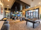 Thumbnail 11 of 18 - A room with a pool table and a bar.