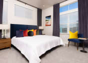 Thumbnail 7 of 25 - model apartment bedroom with large windows at Solasta, Sacramento, CA, 95831