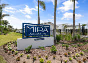 Thumbnail 7 of 79 - a sign that says Mira acting adult living in front of palm trees in Sarasota