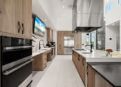 Thumbnail 36 of 79 - resident lounge with coffee bar and  demonstration kitchen at Mira in Sarasota