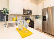 Thumbnail 3 of 25 - model kitchen large counter area at Solasta, Sacramento, CA, 95831