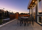Thumbnail 17 of 25 - a terrace with a table and chairs on a balcony at Solasta, Sacramento, CA, 95831